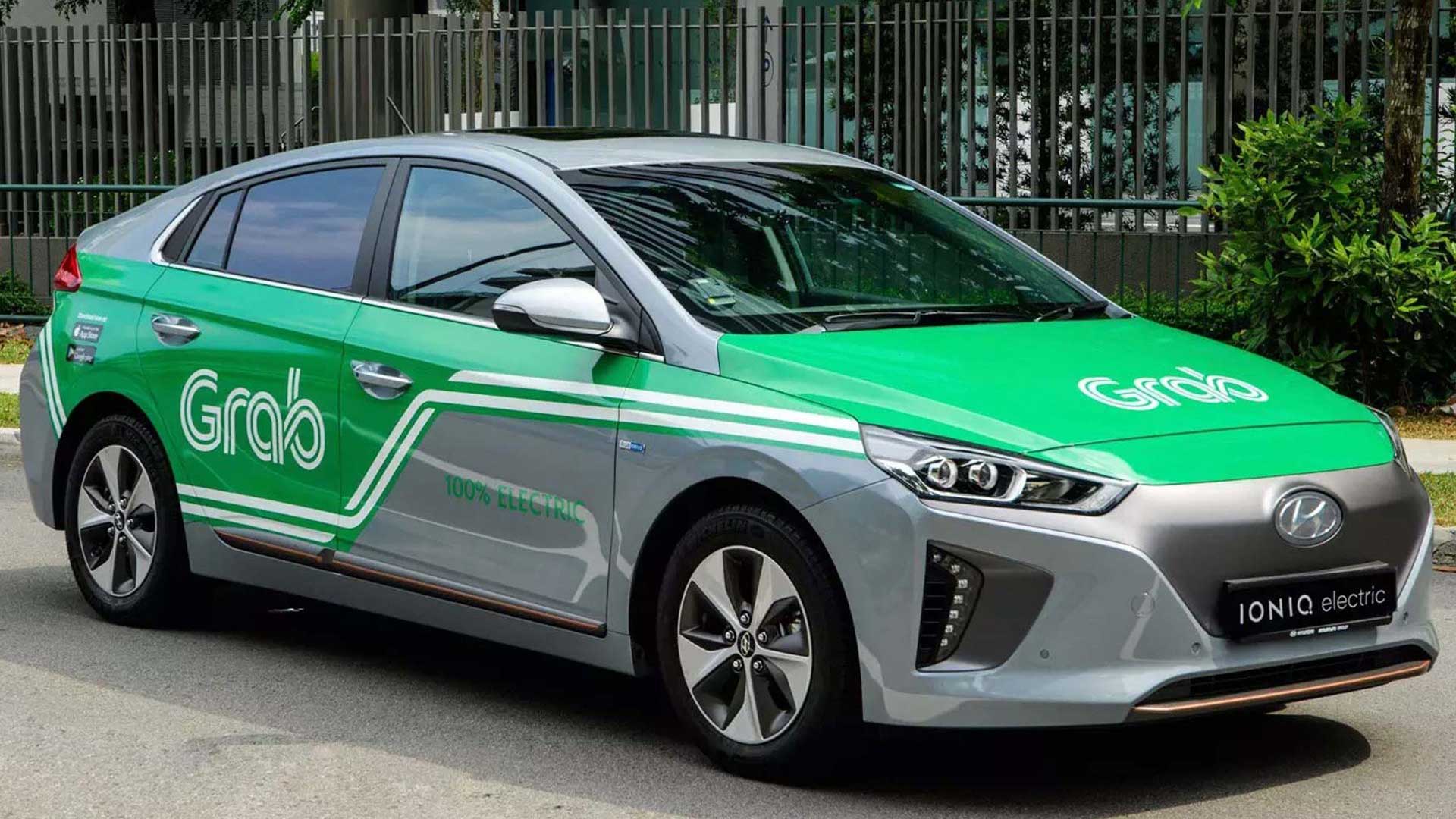 Grab app interface on a smartphone, displaying available ride options and estimated fares