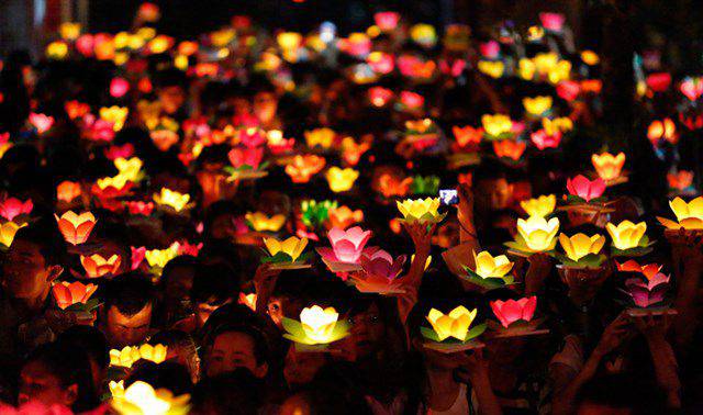 Worshippers offer prayers to their ancestors and to Buddha