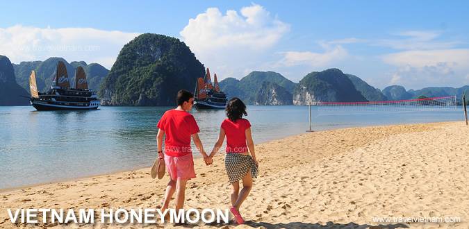 Happy couple embracing on a beach in Vietnam, enjoying their honeymoon.