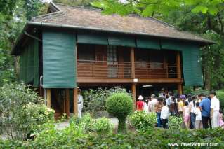 Tourists visiting Uncle Ho's stilt house