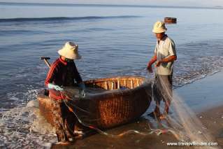 Fishermen collecting fresh fish