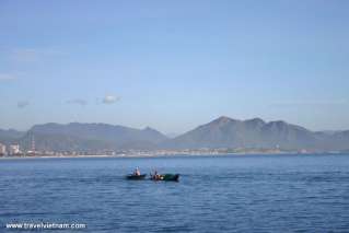 Tiny people on the vast sea