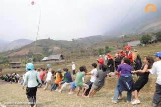 Playing tug of war with local people