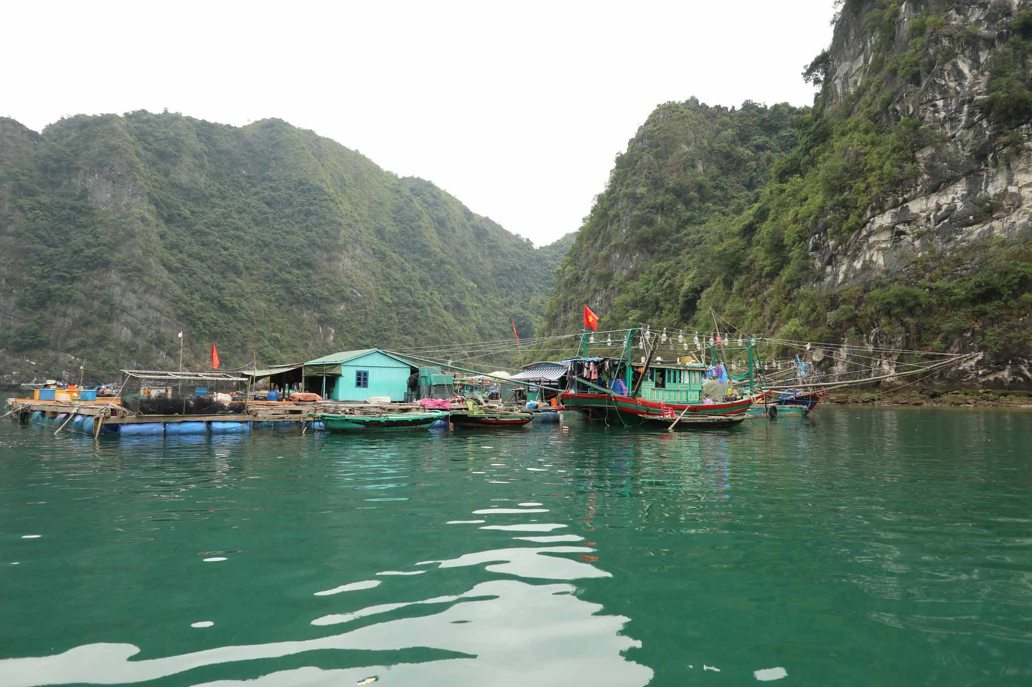 A view of a floating fishing village in Ha Long Bay