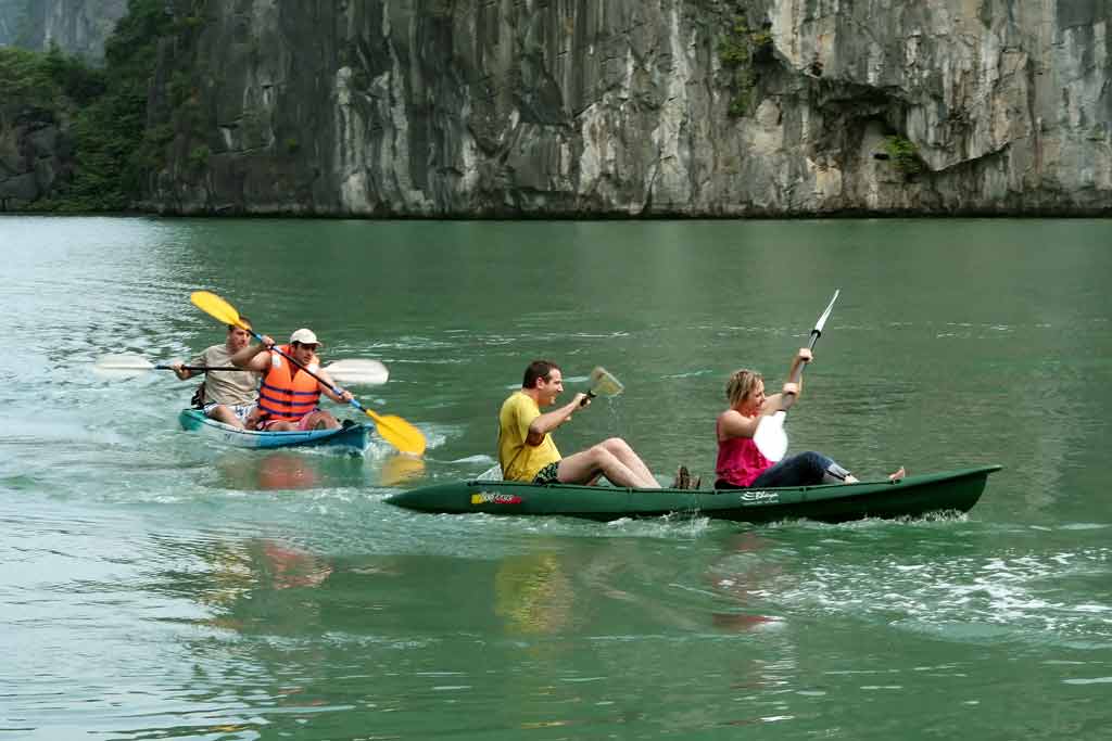 A group of people kayaking in Ha Long Bay in autumn