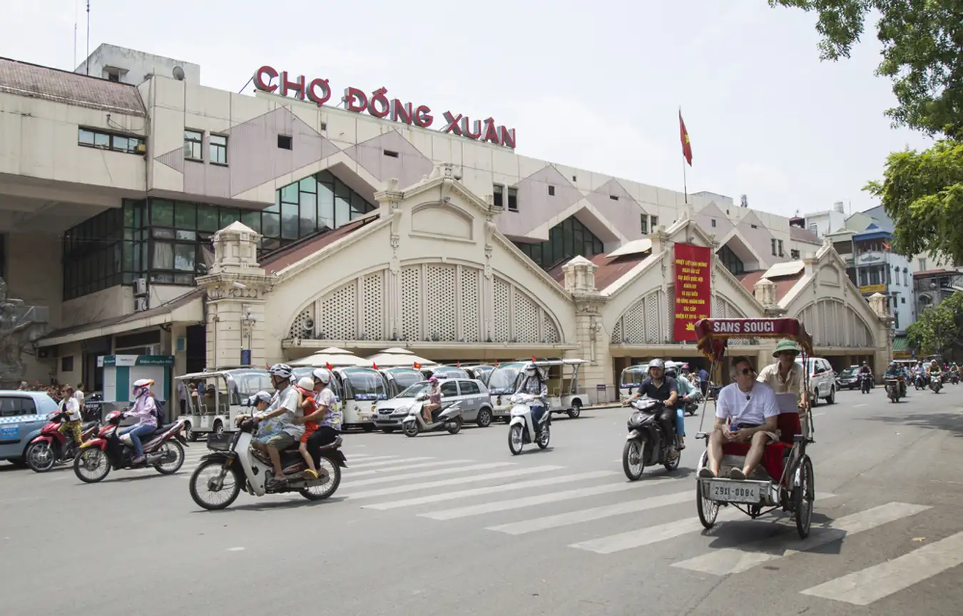 Dong Xuan Market, where a kaleidoscope of colors and a bustling array of goods create a captivating shopping experience